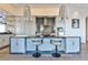 Modern kitchen with island and bar seating, stainless steel appliances, and elegant pendant lighting at 3376 Peachtree Ne Rd # 56, Atlanta, GA 30326