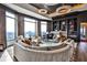 Elegant living room featuring large windows with stunning views, a grand piano, and a cozy seating arrangement at 3376 Peachtree Ne Rd # 56, Atlanta, GA 30326