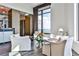 Bright living room featuring white sofas, large windows with city views and hardwood floors at 3376 Peachtree Ne Rd # 56, Atlanta, GA 30326