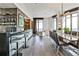 Open living space featuring a bar area, dining table, living room, and abundant natural light at 3376 Peachtree Ne Rd # 56, Atlanta, GA 30326