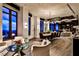 Elegant living and dining area with hardwood floors, large windows, and stylish furniture arrangements in a modern home at 3376 Peachtree Ne Rd # 56, Atlanta, GA 30326