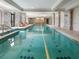 A stunning indoor pool features sleek design, natural light, and relaxing lounge areas at 3376 Peachtree Ne Rd # 56, Atlanta, GA 30326