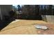 Spacious backyard with dry grass, wooden fence, partial hardscape with a fire pit at 4845 Dartford Dr, Powder Springs, GA 30127