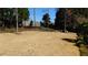 Large grassy backyard area with a wood fence surrounding the perimeter of the property at 4845 Dartford Dr, Powder Springs, GA 30127