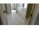 Well-lit bathroom features tile flooring, a soaking tub, and a separate shower with glass doors at 4845 Dartford Dr, Powder Springs, GA 30127