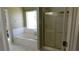 Relaxing bathroom with a soaking tub and a separate shower featuring glass doors at 4845 Dartford Dr, Powder Springs, GA 30127