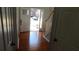 Entryway with hardwood floors and a staircase leading to the second story and a front door leading outside at 4845 Dartford Dr, Powder Springs, GA 30127