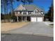 Charming two-story home with a well-maintained lawn, a two-car garage, and a welcoming front porch at 4845 Dartford Dr, Powder Springs, GA 30127