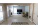 Inviting living room featuring a fireplace and plush carpeting, adjacent to a tiled kitchen at 4845 Dartford Dr, Powder Springs, GA 30127