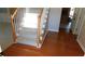 Carpeted staircase features hardwood floors, bright natural light and leads to the upper level of the home at 4845 Dartford Dr, Powder Springs, GA 30127