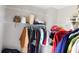 Organized walk-in closet with shelving and hanging space for clothes and accessories at 4845 Dartford Dr, Powder Springs, GA 30127