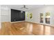 Spacious main bedroom features hardwood floors, statement wall, recessed lights and private balcony at 561 Ashburton Ave, Decatur, GA 30032