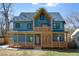 Stunning two-story home with a modern facade, inviting porch, and impeccable architectural details at 561 Ashburton Ave, Decatur, GA 30032