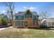 Beautiful two-story home featuring a stylish design, welcoming front porch, and manicured lawn at 561 Ashburton Ave, Decatur, GA 30032