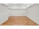 Large walk-in closet featuring hardwood floors and built-in shelving at 561 Ashburton Ave, Decatur, GA 30032