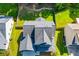 Aerial view of the house shows the roof design and the well-maintained landscaping around the property at 613 Hemlock Ct, Villa Rica, GA 30180