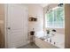 Bathroom features bathtub, decor, and modern finishes at 613 Hemlock Ct, Villa Rica, GA 30180