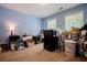 Blue bedroom with carpet, boxes, and windows at 613 Hemlock Ct, Villa Rica, GA 30180