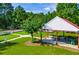 Scenic community park with a covered picnic area, playground and lush green space for outdoor activities at 613 Hemlock Ct, Villa Rica, GA 30180