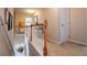 Second floor hallway featuring neutral walls and plush carpeting at 613 Hemlock Ct, Villa Rica, GA 30180