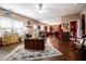 Open living area with hardwood floors, a fireplace, and views of the kitchen at 613 Hemlock Ct, Villa Rica, GA 30180