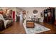 Inviting living room with hardwood floors, neutral walls, and a decorative rug at 613 Hemlock Ct, Villa Rica, GA 30180