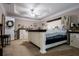 Spacious main bedroom featuring a tray ceiling and neutral color scheme at 613 Hemlock Ct, Villa Rica, GA 30180