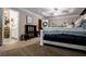 Main bedroom boasts a tray ceiling with a ceiling fan and lots of natural light at 613 Hemlock Ct, Villa Rica, GA 30180