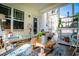 Covered back porch featuring outdoor furniture, plants, and stylish decorations at 613 Hemlock Ct, Villa Rica, GA 30180
