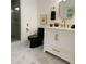Charming bathroom featuring marble floors, and a sleek black toilet to complement the gold fixtures at 5531 Four Winds Sw Dr, Lilburn, GA 30047