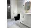 Bathroom with dark fixtures, large vanity, and modern shower at 5531 Four Winds Sw Dr, Lilburn, GA 30047