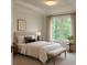 Bedroom with furniture and a view to the yard at 5531 Four Winds Sw Dr, Lilburn, GA 30047