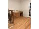 Bright office space with built-in wooden desk, drawers and shelving, with light wood floors and white trim at 5531 Four Winds Sw Dr, Lilburn, GA 30047