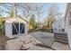 Backyard featuring a detached storage shed, concrete patio and landscaped areas at 1376 Westmont Sw Rd, Atlanta, GA 30311