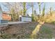 A backyard with a shed, grass, and bare trees provides a private outdoor space at 1376 Westmont Sw Rd, Atlanta, GA 30311