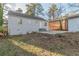 Exterior view of the backyard with a patio, shed, and fenced area, showcasing the outdoor space at 1376 Westmont Sw Rd, Atlanta, GA 30311