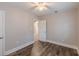 This bedroom features hardwood floors, neutral paint, and two doors with white trim at 1376 Westmont Sw Rd, Atlanta, GA 30311