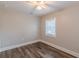 This bedroom has hardwood floors, neutral paint, and a window that lets in plenty of natural light at 1376 Westmont Sw Rd, Atlanta, GA 30311