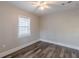 Bedroom featuring wood-look floors, neutral walls, and a ceiling fan at 1376 Westmont Sw Rd, Atlanta, GA 30311