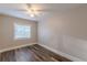 A cozy bedroom features wood-look flooring and a ceiling fan for added comfort at 1376 Westmont Sw Rd, Atlanta, GA 30311