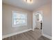 Dining area featuring updated flooring and an open view into the bright kitchen at 1376 Westmont Sw Rd, Atlanta, GA 30311