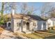 Charming single-story home featuring a brick chimney, updated windows and a covered front porch at 1376 Westmont Sw Rd, Atlanta, GA 30311