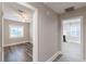 Hallway view into two rooms featuring updated flooring and neutral wall colors at 1376 Westmont Sw Rd, Atlanta, GA 30311