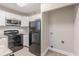 A kitchen with modern appliances and a convenient layout, designed for efficient meal preparation and storage at 1376 Westmont Sw Rd, Atlanta, GA 30311