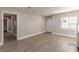 Bright and airy living room with a fireplace, modern flooring, and neutral color palette at 1376 Westmont Sw Rd, Atlanta, GA 30311