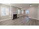 Spacious living room showcasing a fireplace, modern flooring, and neutral color palette at 1376 Westmont Sw Rd, Atlanta, GA 30311