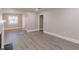 Bright and airy living room featuring modern flooring and a connecting archway at 1376 Westmont Sw Rd, Atlanta, GA 30311