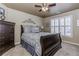 This cozy bedroom features a dark wood dresser and large window at 2059 Sugar Springs Dr, Lawrenceville, GA 30043