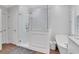 Beautiful bathroom featuring a soaking tub, a glass shower enclosure, and wood look tile flooring at 2599 Oglethorpe Ne Cir, Brookhaven, GA 30319