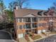 Beautiful brick townhouse with multiple levels of balconies, adding outdoor living space and architectural interest at 2599 Oglethorpe Ne Cir, Brookhaven, GA 30319